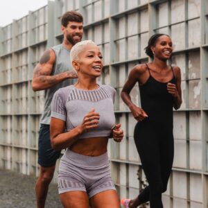 Athletes running in the city, maintaining a healthy lifestyle with Howganics Semaglutide + B12 Sho