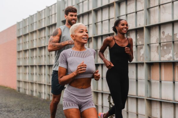 Athletes running in the city, maintaining a healthy lifestyle with Howganics Semaglutide + B12 Sho
