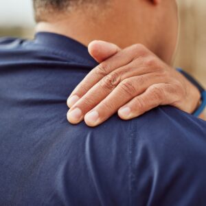 Man experiencing back pain while exercising, highlighting the benefits of Howganics PRP Therapy for pain relief and muscle recovery.