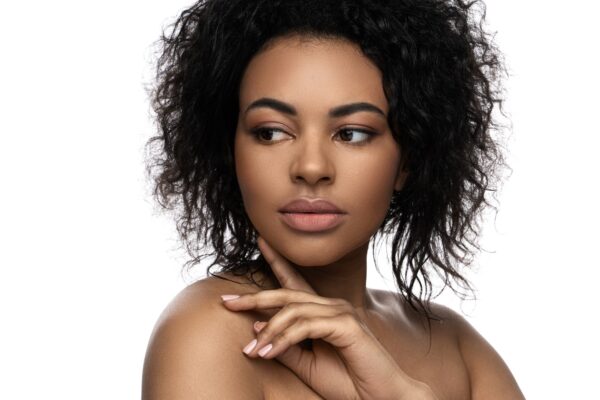 Beautiful black woman with smooth skin on white background