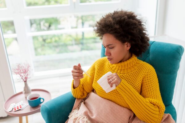 Sick woman sneezing