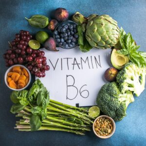 Assortment of Vitamin B6-rich foods including fruits, nuts, and vegetables, symbolizing energy, brain health, and immune support benefits of Howganics Vitamin B6 Shot